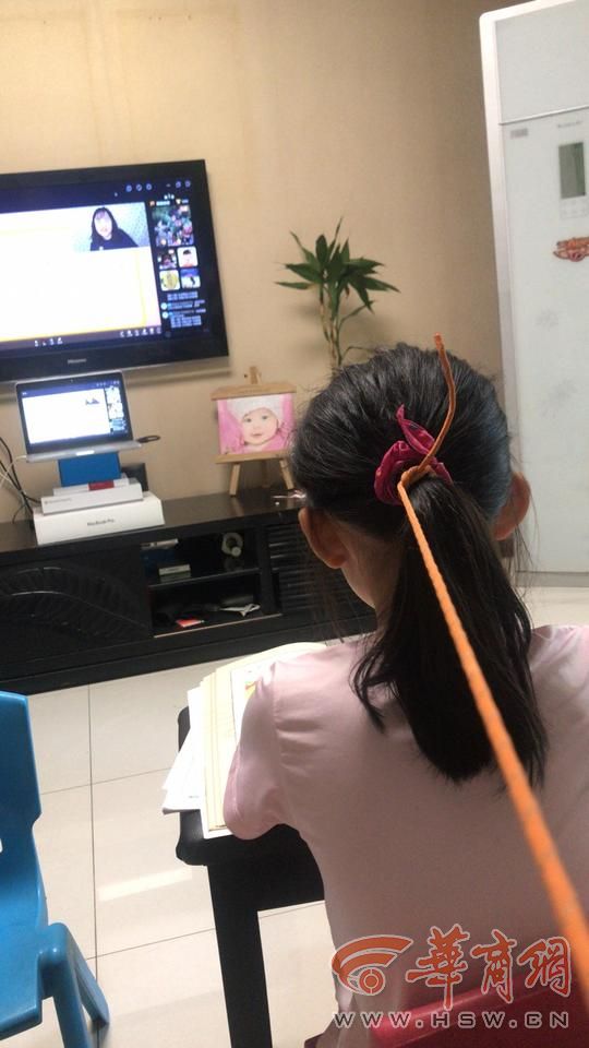 Mother Uses Rope to Hold Braid of Daughter