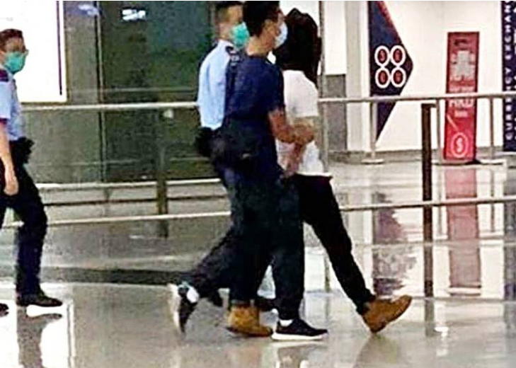 The thug was arrested by the Hong Kong police at the airport in the early morning 